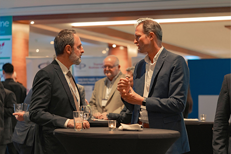 two men speaking in networking break