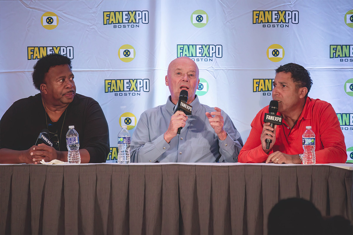 oscar, creed, and leslie from the office speak on stage