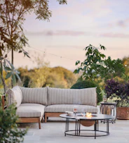 outdoor corner sofa with stripy pillows