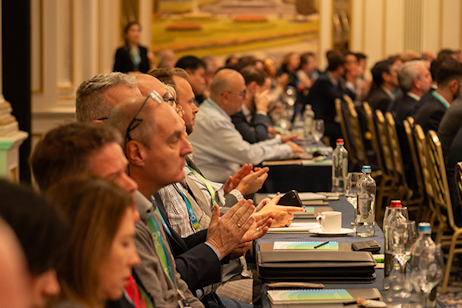 Engaged attendees applauding during a scientific panel discussion on plant nutrition at New Ag International Annual.