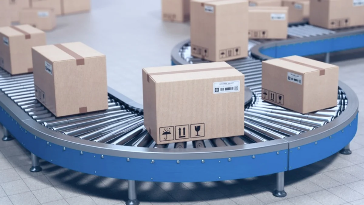 A conveyor belt transporting several boxes in a warehouse setting