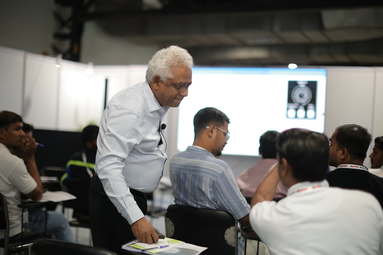 Trainer engaging with attendees in an AV education session at PALM Expo