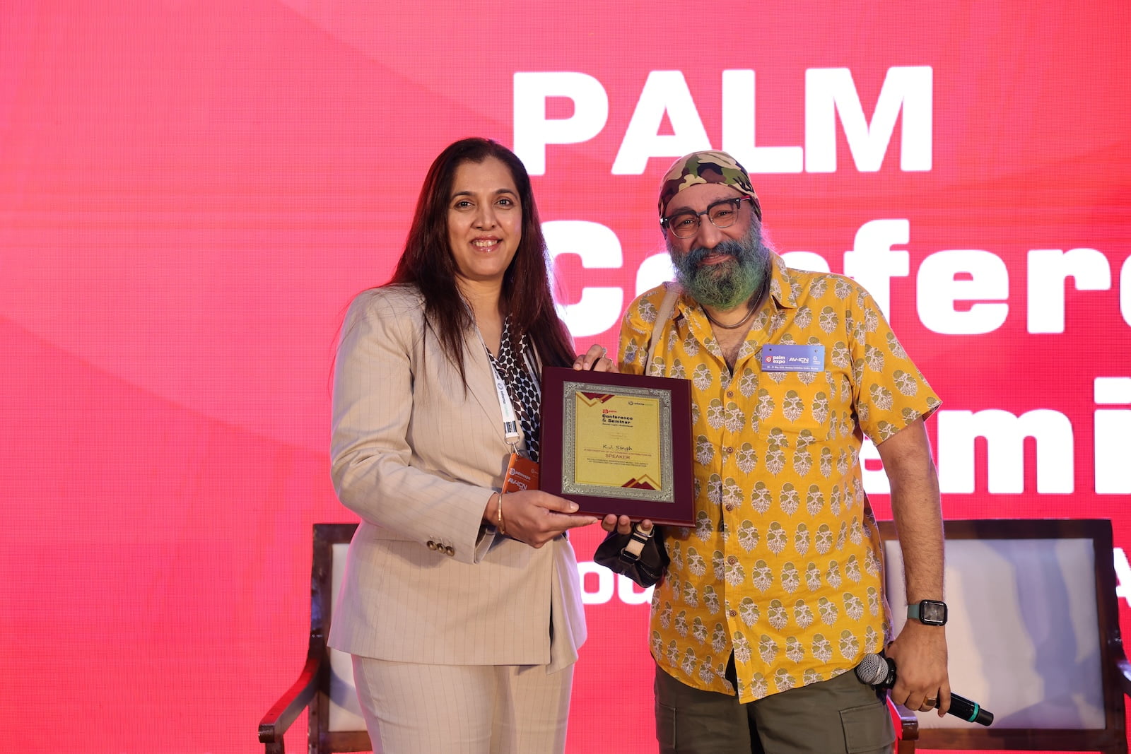 Award presentation on stage at PALM Conference & Seminar 2025