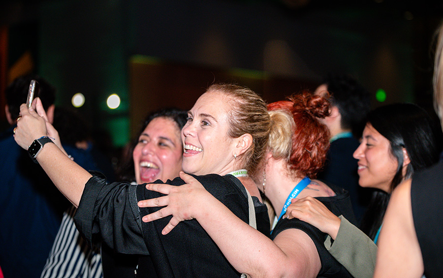 Greenbuild attendees take a photo at Greenbuild 2023