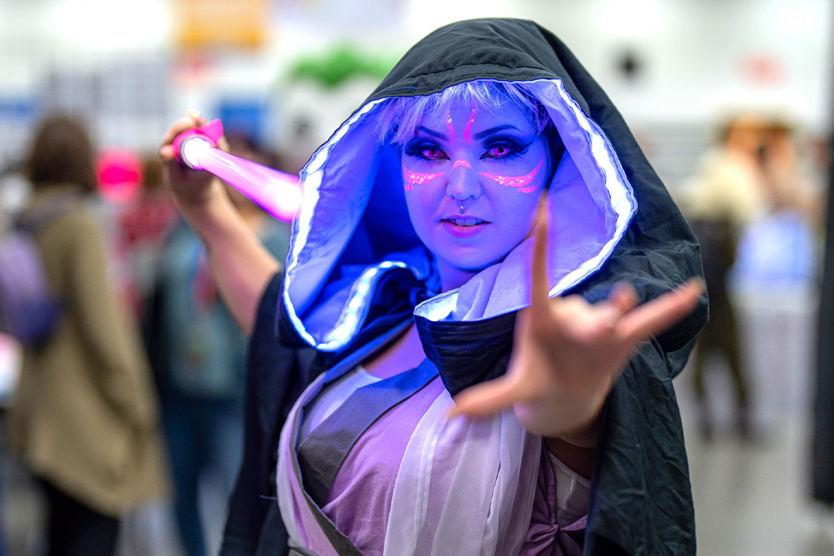 a cosplayer poses for the camera