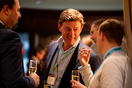 Attendees networking over drinks at World Ethanol & Biofuels 2025, fostering international biofuels business connections.