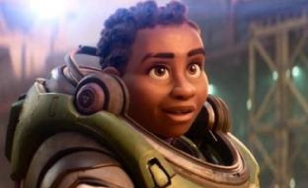 Black lesbian cartoon astronaut smiles wistfully at the camera