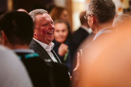 Attendees connecting at World Ethanol & Biofuels in Brussels, discussing business opportunities during evening networking reception.