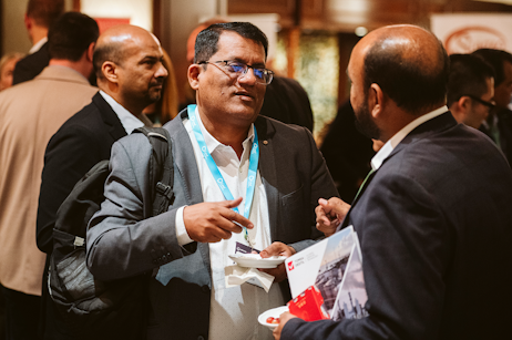 Attendees at World Ethanol & Biofuels in Brussels exchanging ideas during networking session focused on sustainable energy markets.