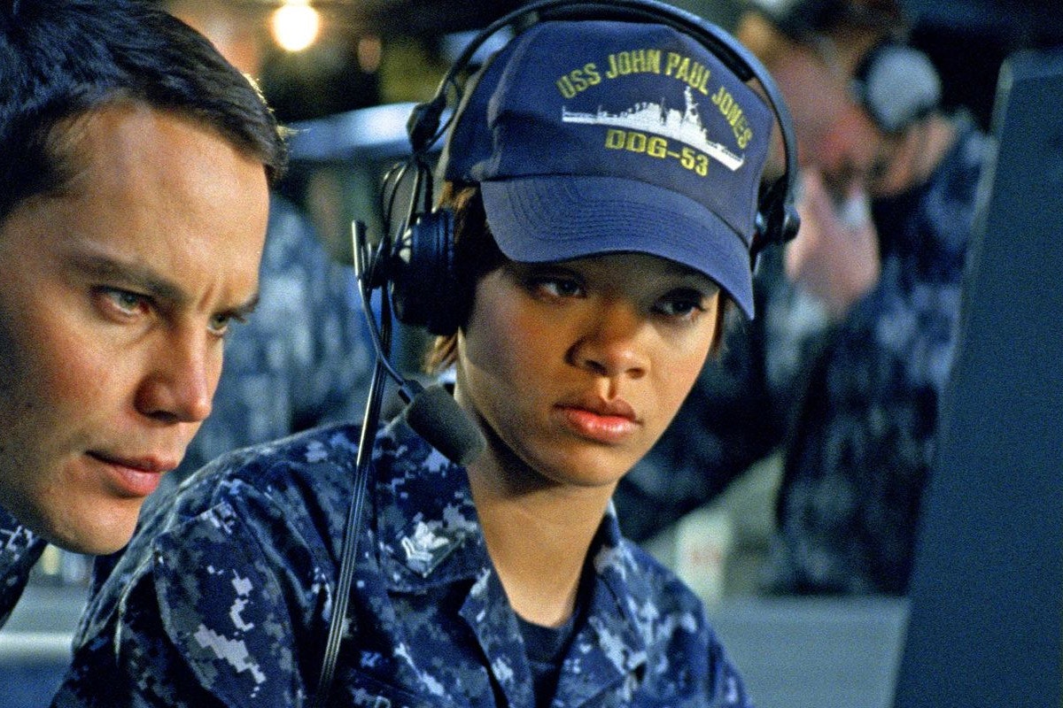 Rihanna looks pensively at the computer on a US Navy ship