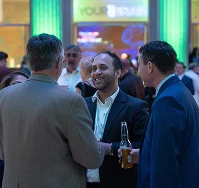 People attending and talking at the event