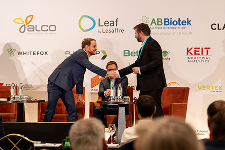 Sponsor handshake at World Ethanol & Biofuels 2025 exhibition in Brussels, highlighting technology partnerships and sponsorship opportunities.