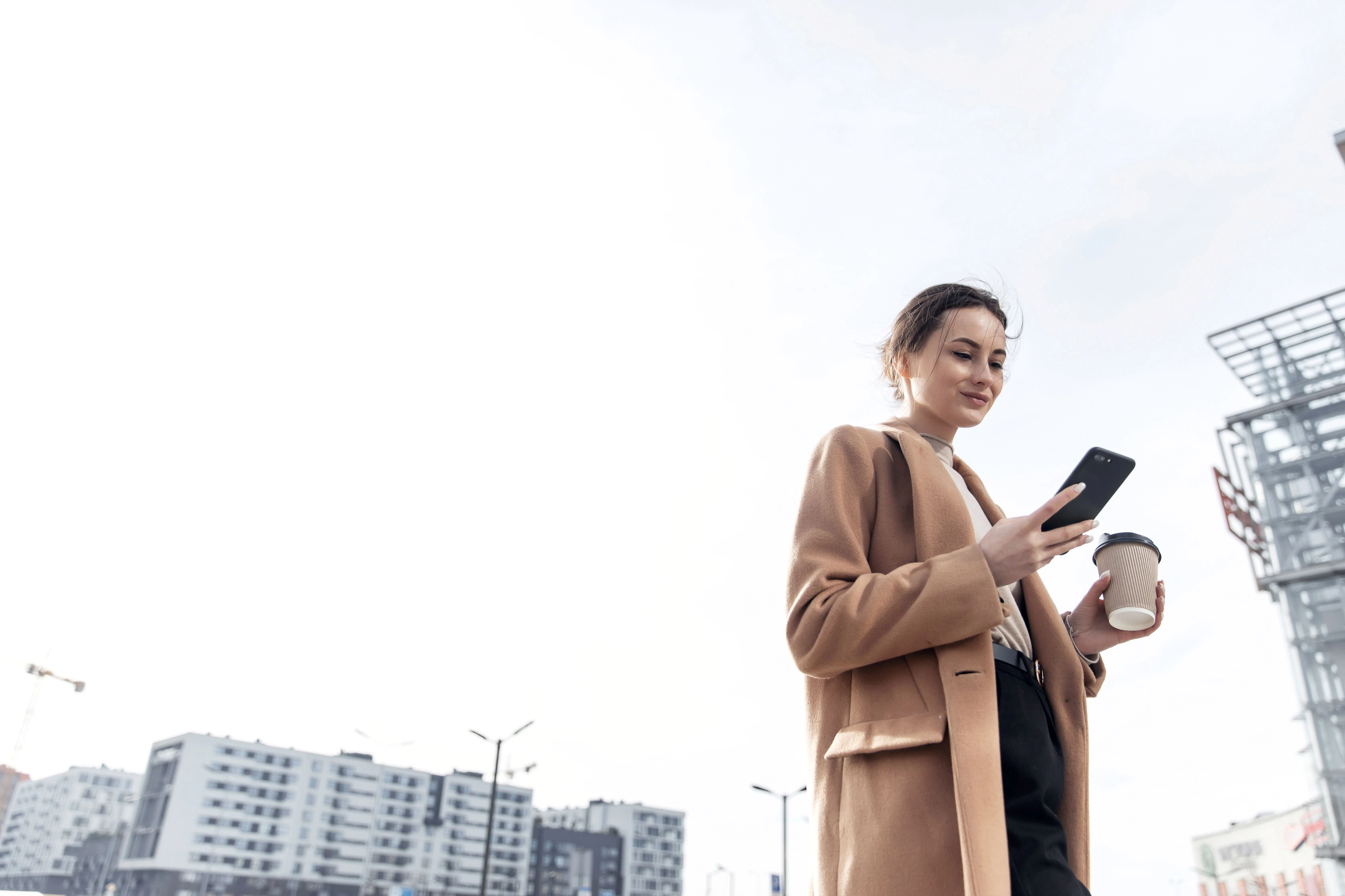 An image of woman looking at her phone