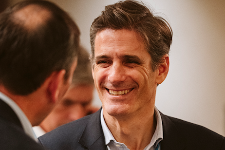 Delegate smiling during the Evening Trade Seminar networking reception at World Ethanol & Biofuels 2025 in Brussels