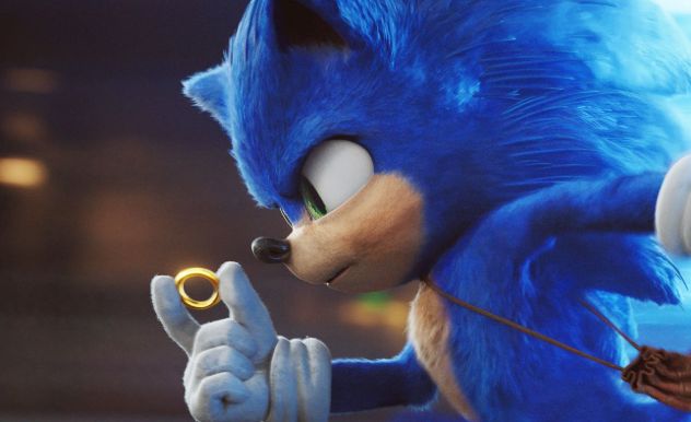 Sonic the Hedgehog holding a coin and running