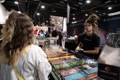 Fans talk to the team at Copper Coast Confections, and order some fudge. Under the glass, multiple different fudge options are available for purchase.