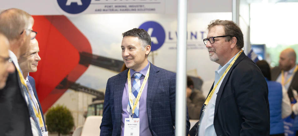 Attendees networking at a maritime and port industry event.