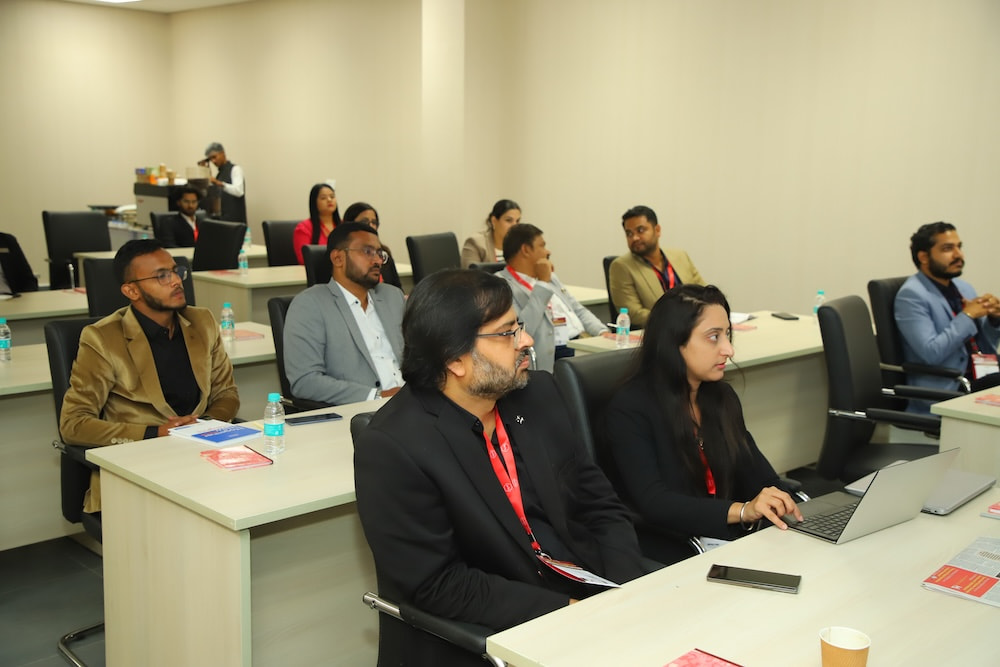 Instructor delivering a technical AV lecture with a visual presentation at PALM Expo