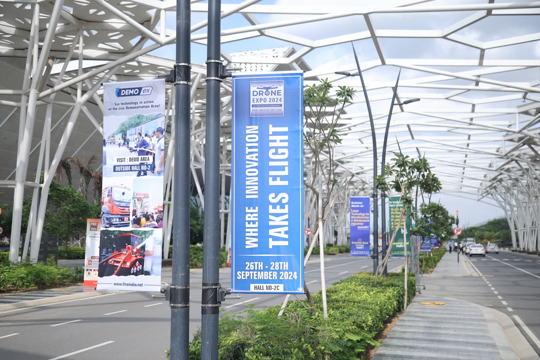 Outdoor pole banners at Yashobhoomi IICC, Delhi showing sponsor branding along the road for Tools & Equipment Expo.
