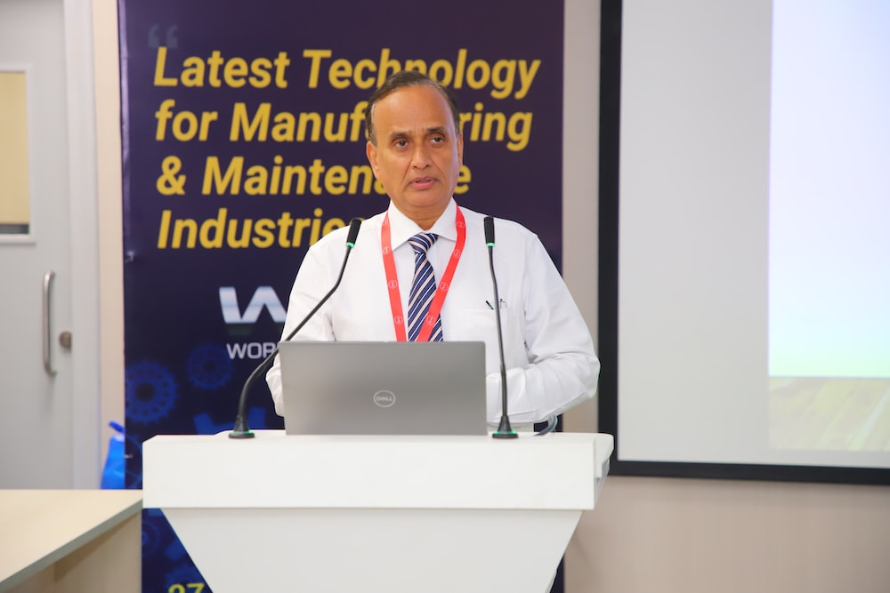 Industry expert delivering insights at the networking meet podium.