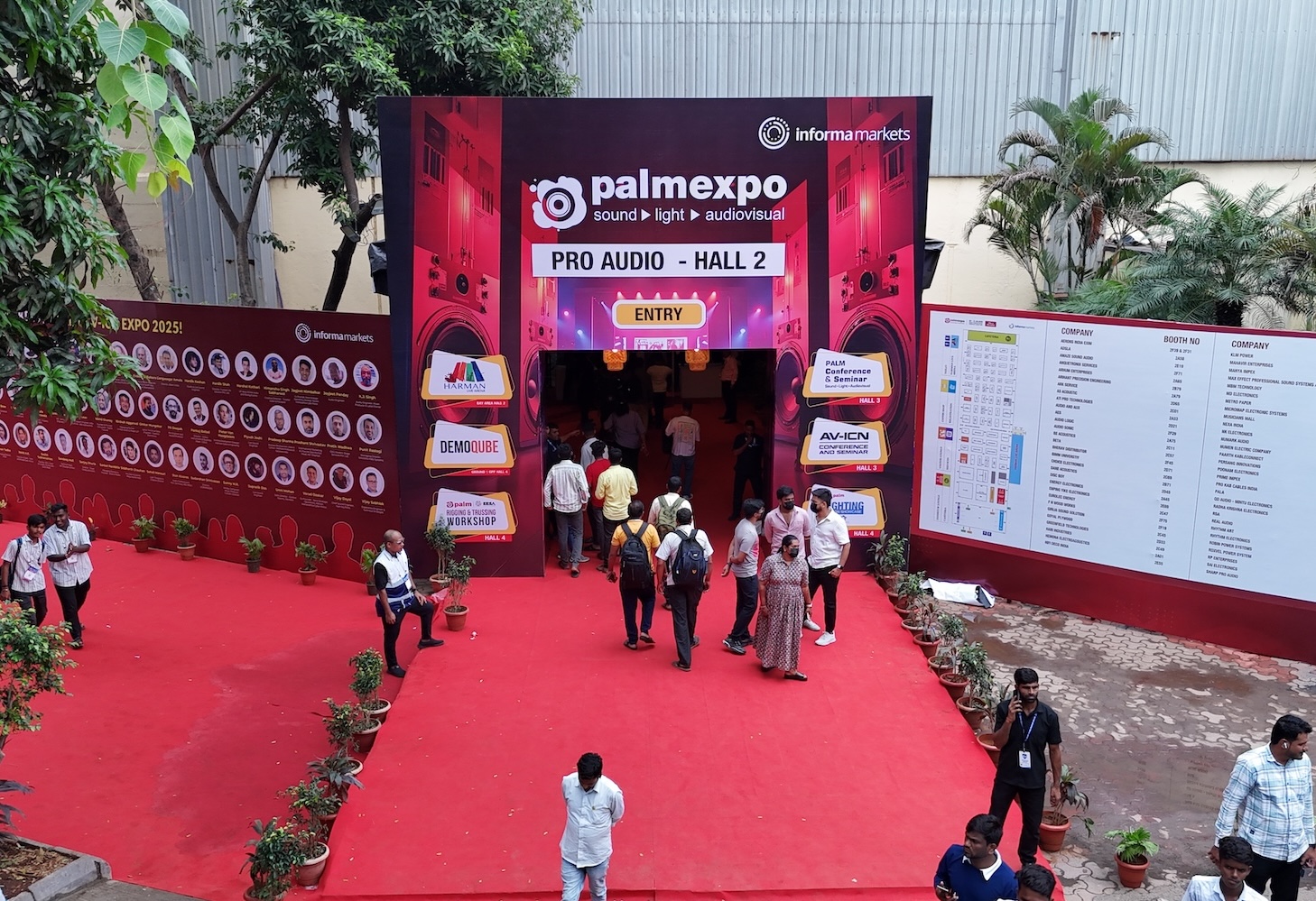 People entering the venue from outside, walking towards one of the entrances of Palm Expo