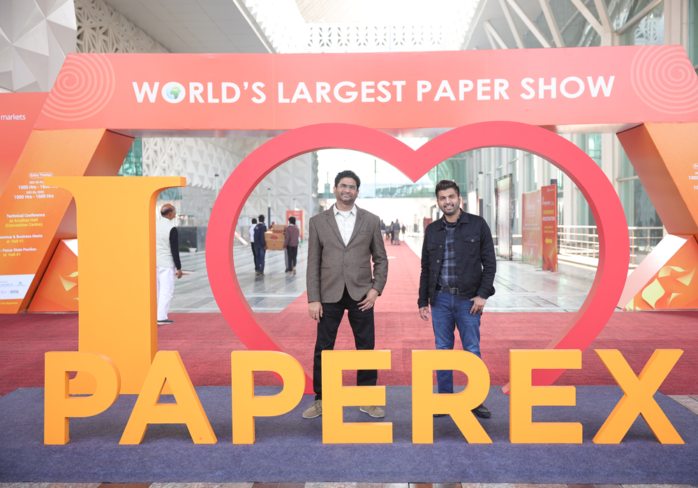 Attendees entering through the main entrance at Paperex