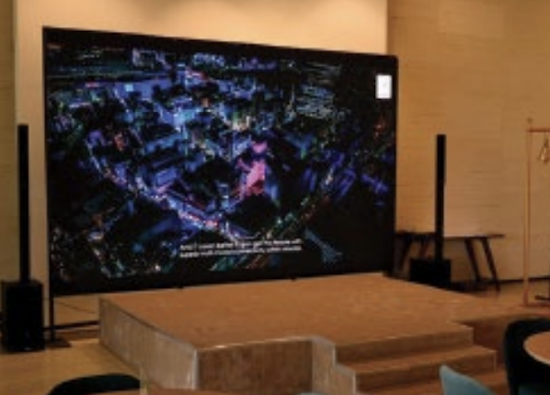 Crowded aisles at the AV-ICN trade fair with attendees walking through the exhibition area.