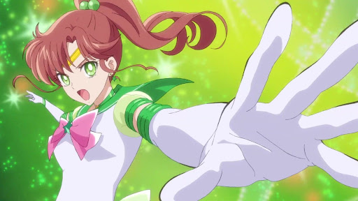Sailor Jupiter reaches out towards the screen, her mouth agape as she speaks, summoning her power.