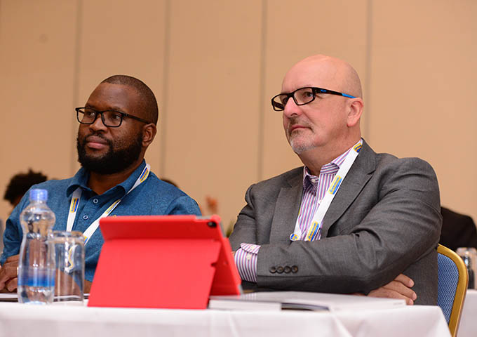 listening to presentations at Africa Sugar Conference