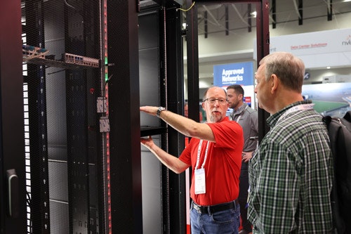 Exhibitor talking to Data Center World attendees