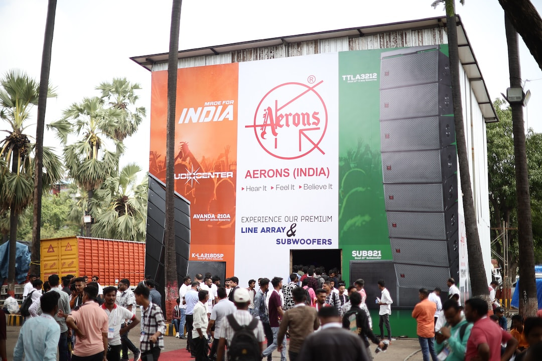 Outdoor area of the event with attendees walking and exploring exterior products on display