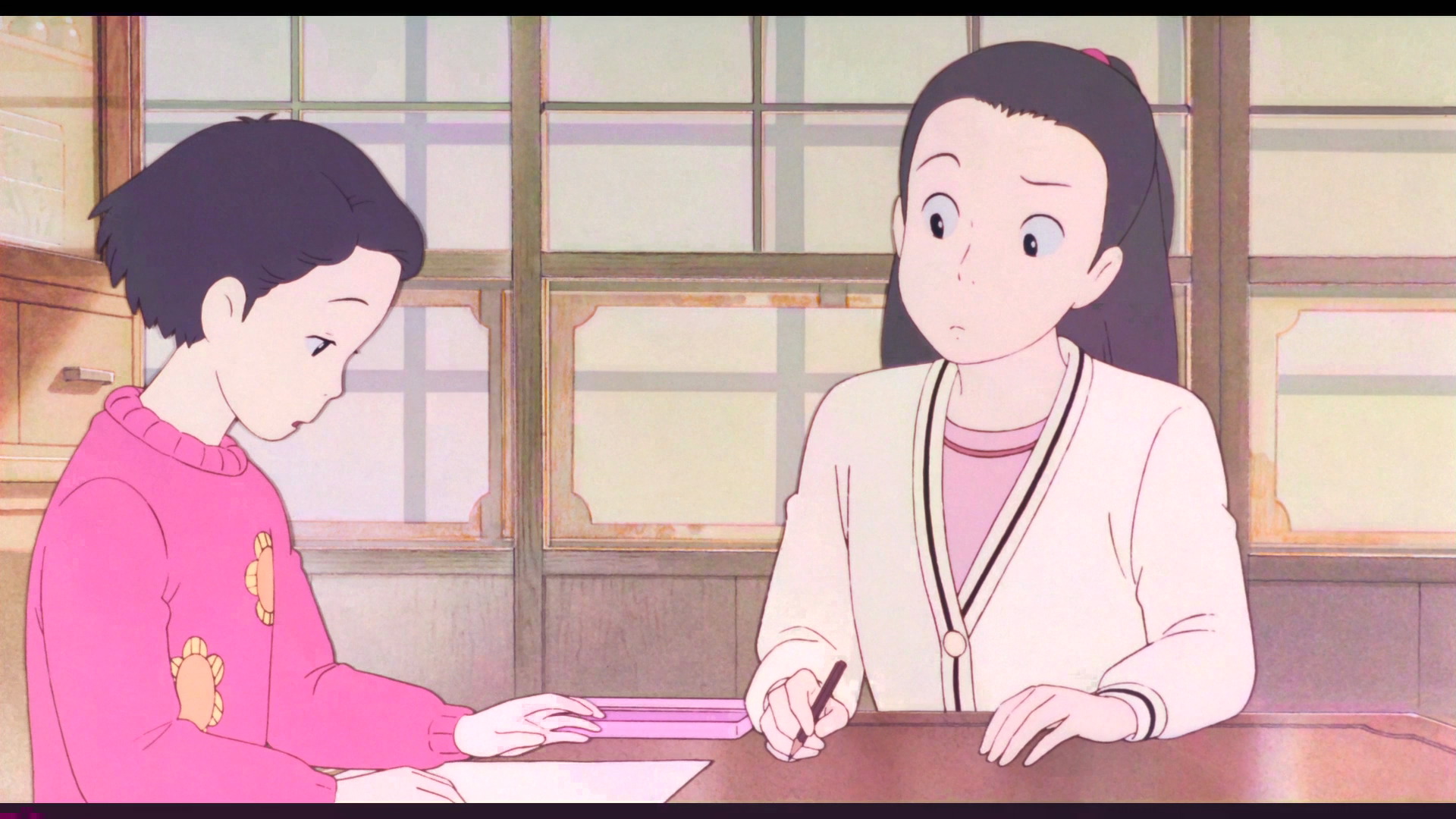 Two characters sit at a table looking at a blank piece of paper